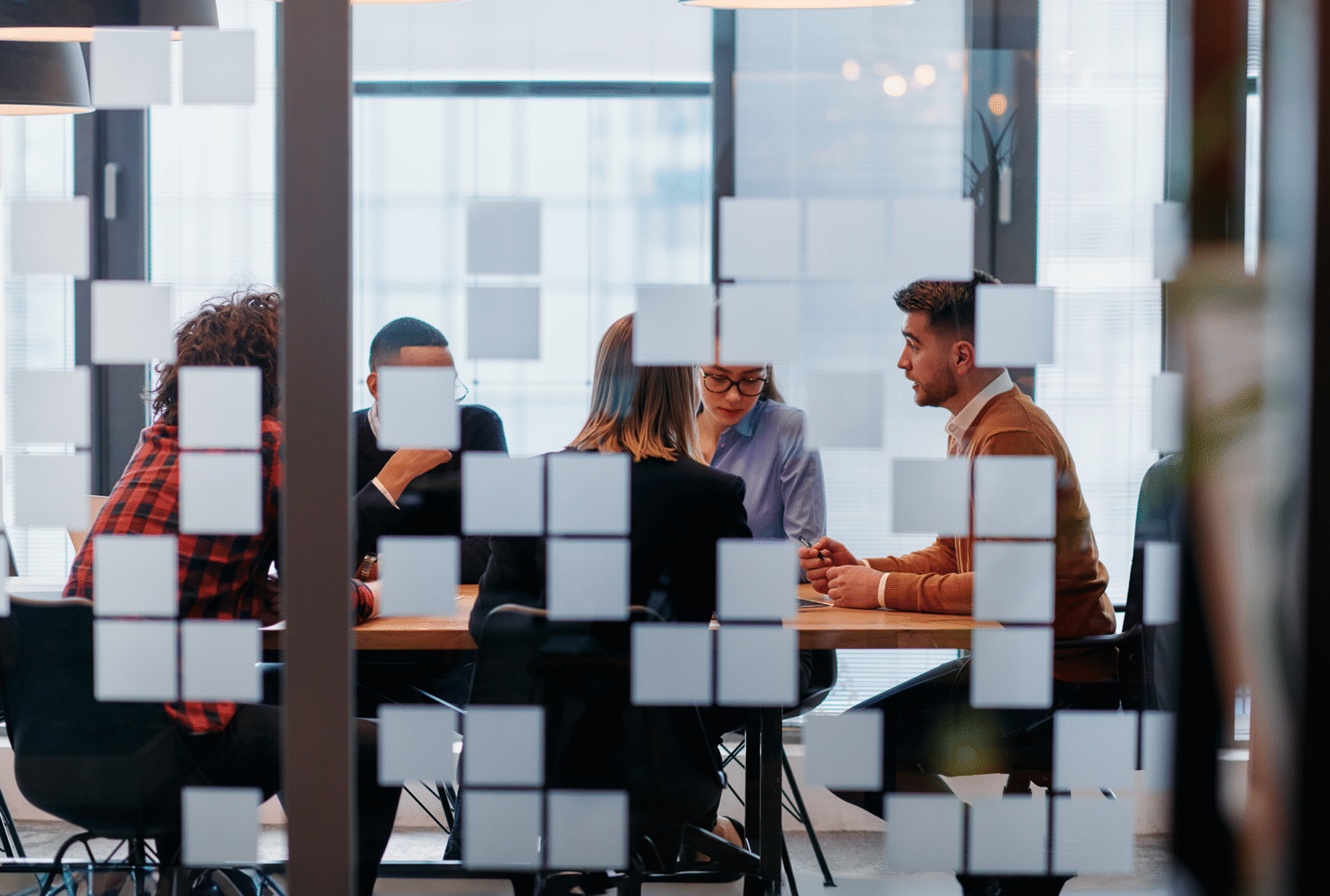 Business team in discussion symbolizing the next generation of procurement skills and collaboration